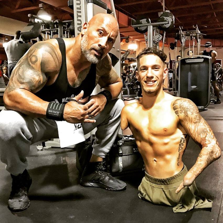 Dwayne Johnson The Rock inspirational picture in the gym with a disabled man