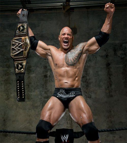 Dwayne Johnson The Rock holding a champion belt and screaming