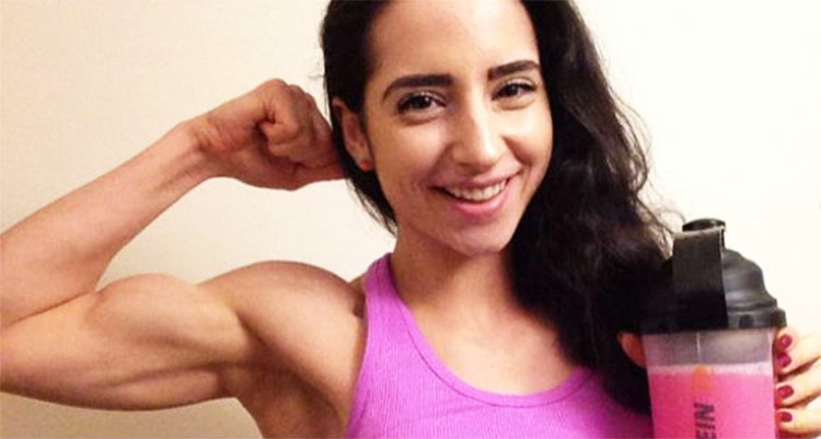 Sarah Ramadan proudly presenting her bicep - showing her muscle gains.