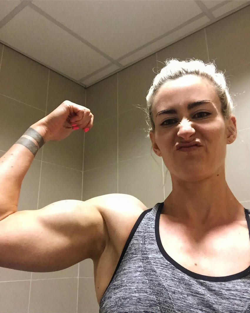 lucy sewell flexing bicep 