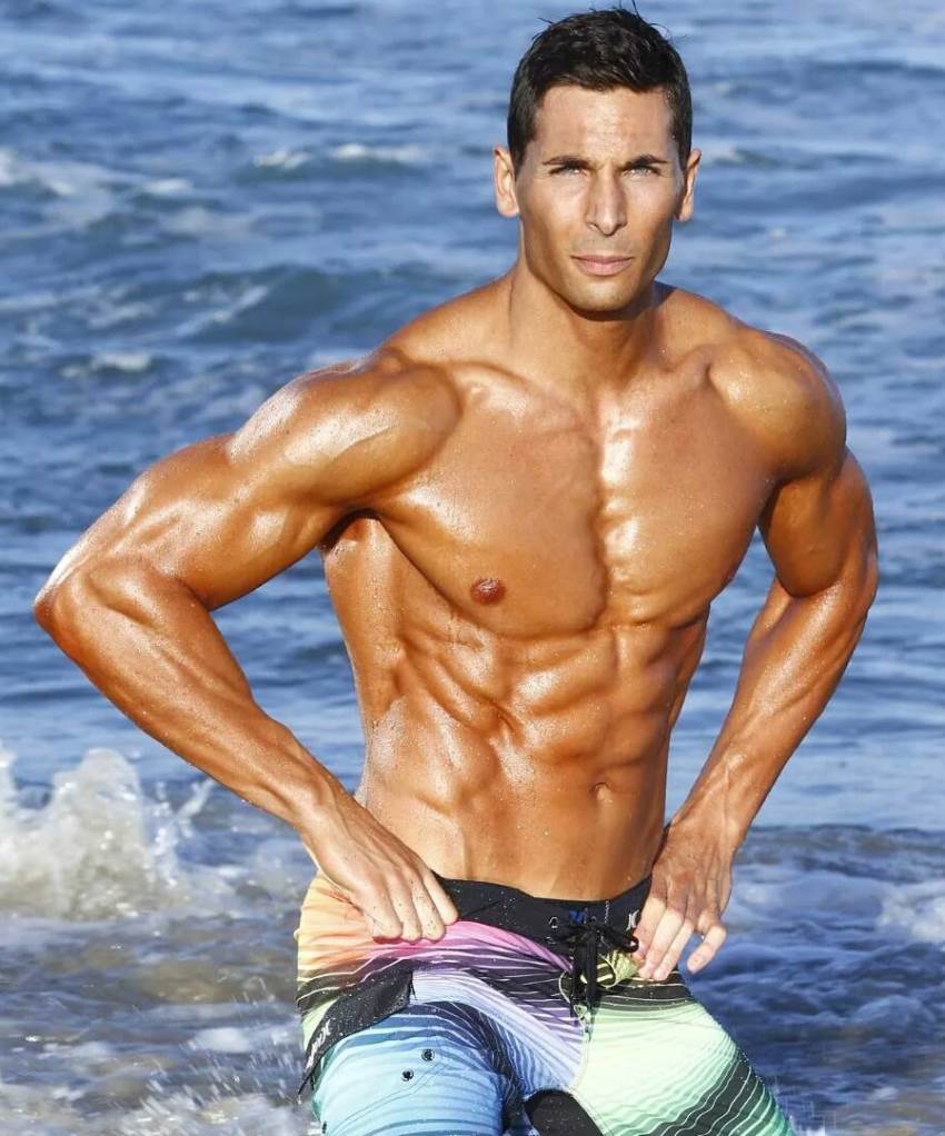 mike raso on a beach in the ocean