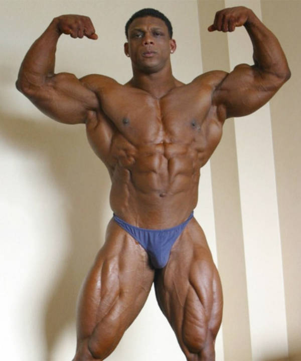 quincy taylor wears blue trunks and flexes his arms