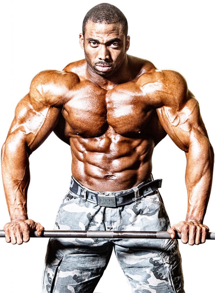 Cedric McMillan showing his biography showing his muscular definition.