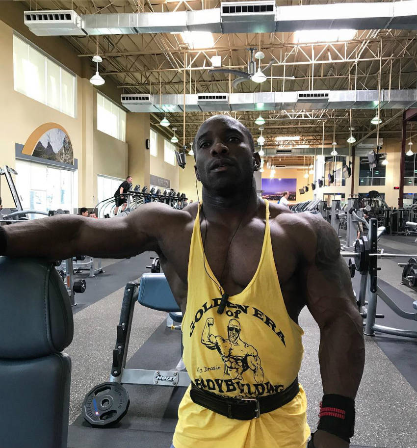 Damion Ricketts working out in a 'golden era of bodybuilding' vest