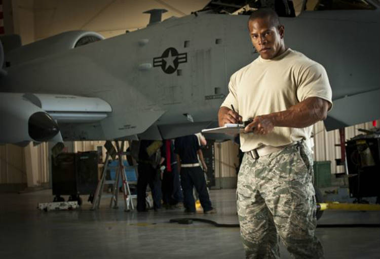 David Henry standing next to a fighter jet