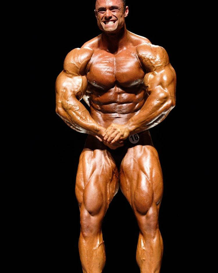 Frank Mcgrath smiling at a competition while posing