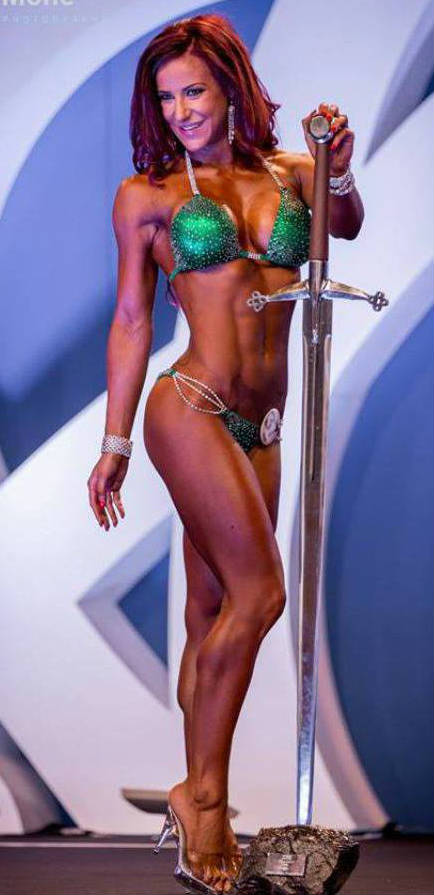 Georgia B Simmons posing with the first place trophy at a competition