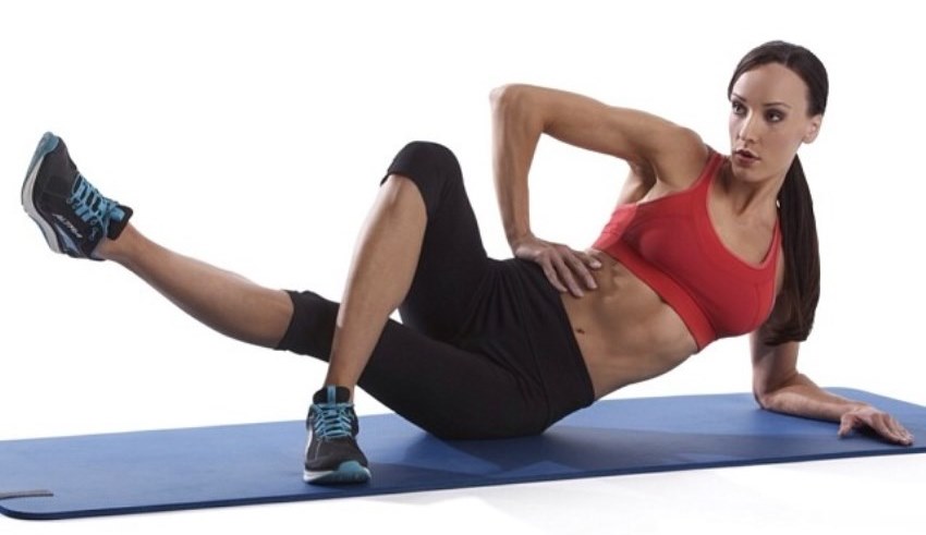 Heidi Carlsen doing exercises and stretches on a pilates mat