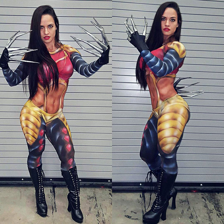 Renee Enos wearing a cosplay outfit with claws while posing and showing her strong muscles 