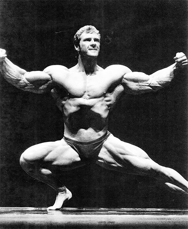 Scott Wilson posing on stage towards the start of his career.