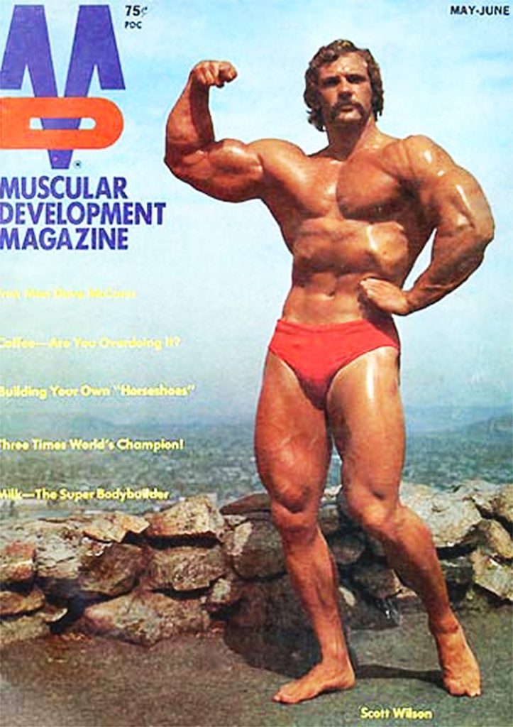 Scott Wilson posing, tensing his arms on the cover of an old magazine in the 1970-1980's. 