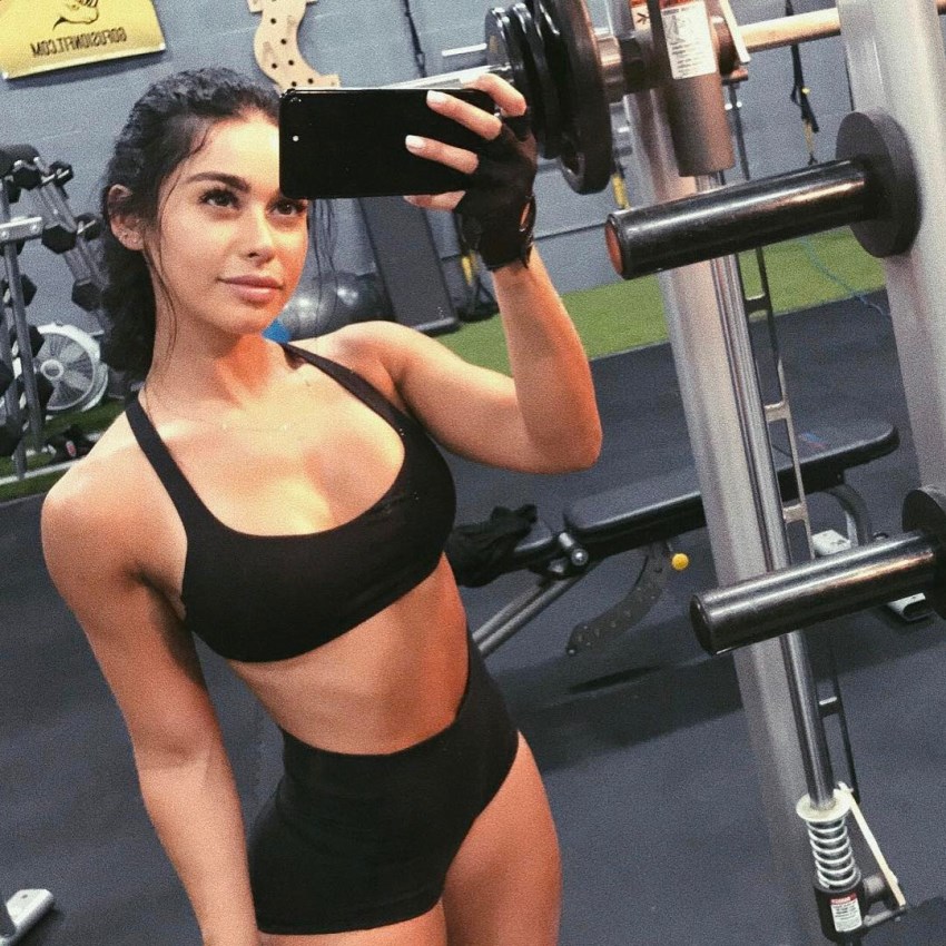 Another selfie of Stephanie rao, this time in the gym, showing her abs and arms