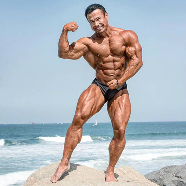 Danny Hester posing on the beach in California