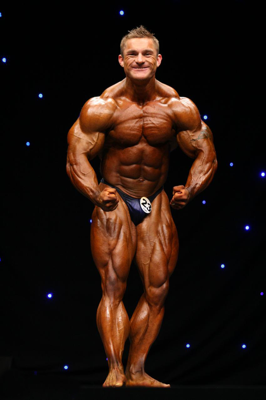 James Flex Lewis in a most muscular pose on the stage