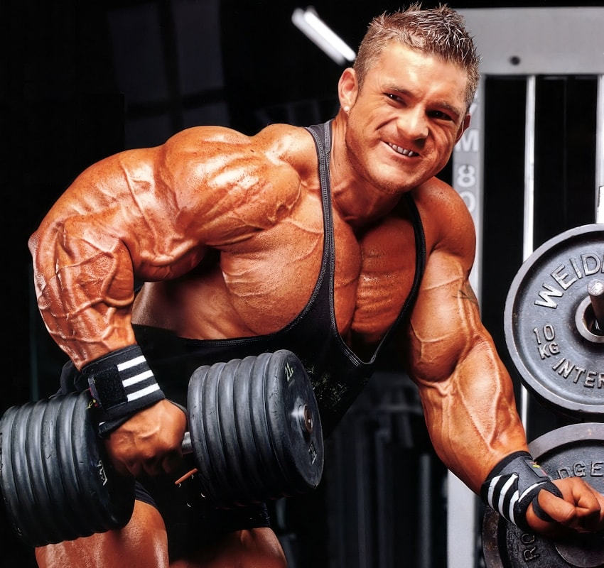 Profile picture of James Flex Lewis, doing dumbbell bent over rows for a photoshoot