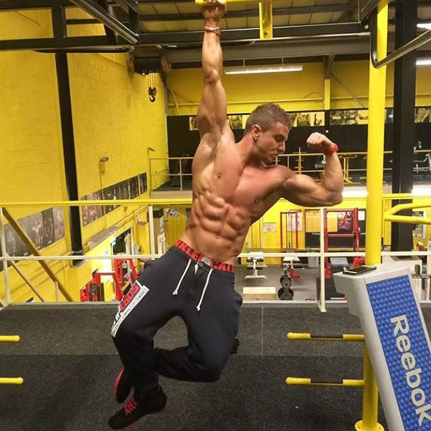 josef rakich hanging from a bar in the gym