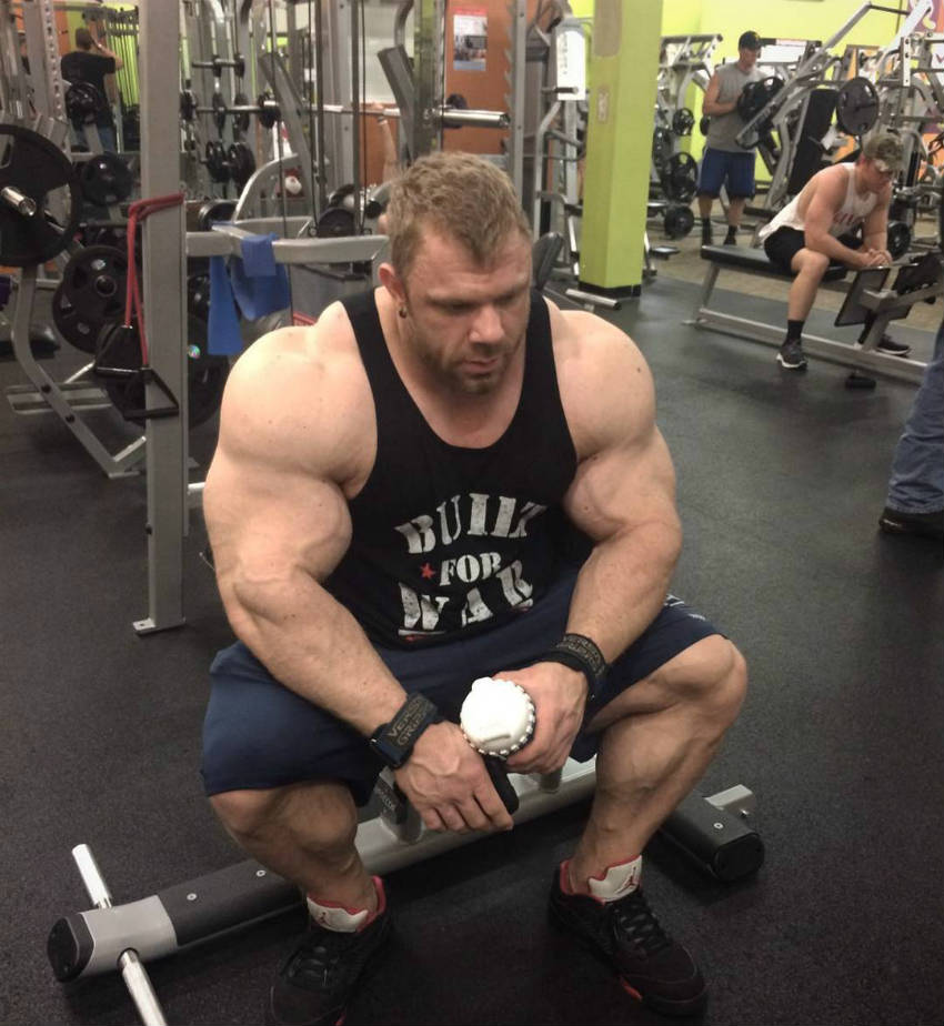 justin compton sitting tired in the gym