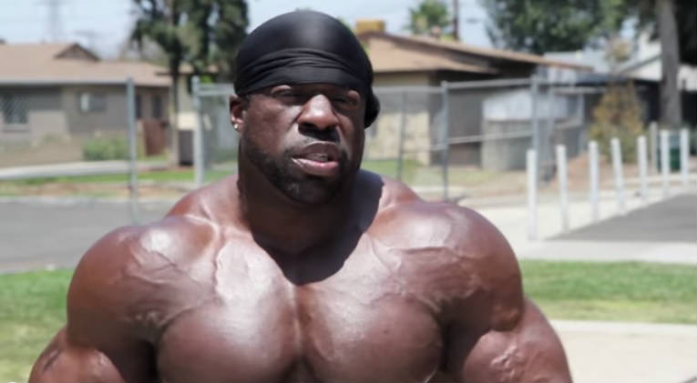 kali muscle standing in his neighborhood