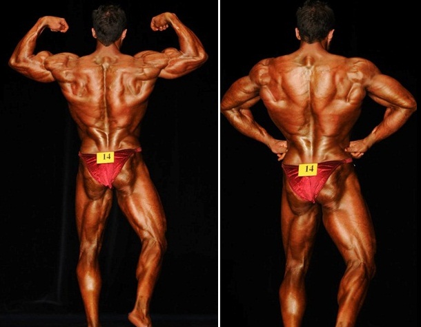 Layne Norton posing on the stage, showing his conditioned and tanned back and legs to the audience and judges