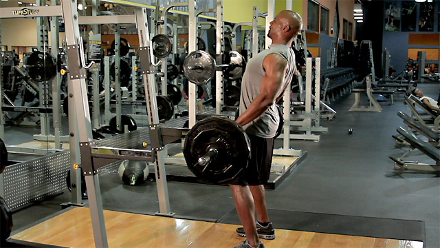 Terry Crews performing deadlifts in a gym