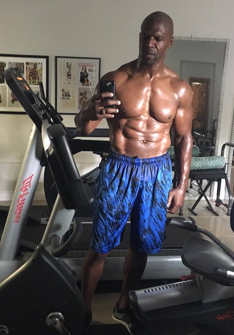 Terry Crews selfie on a treadmill machine, showing his seaty body after a long and intense cardio session