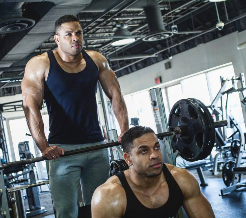 The Hodgetwins preparing to do a bench press