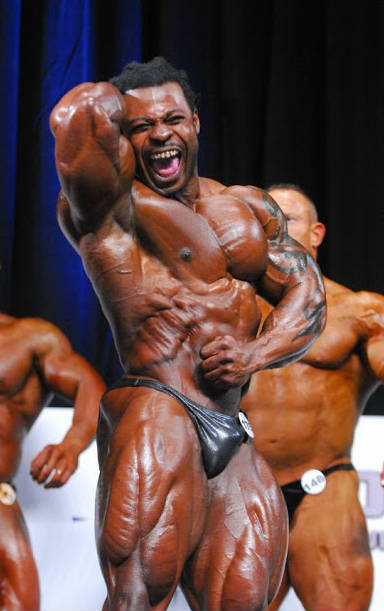 william bonac tensing bicep and shouting at competition