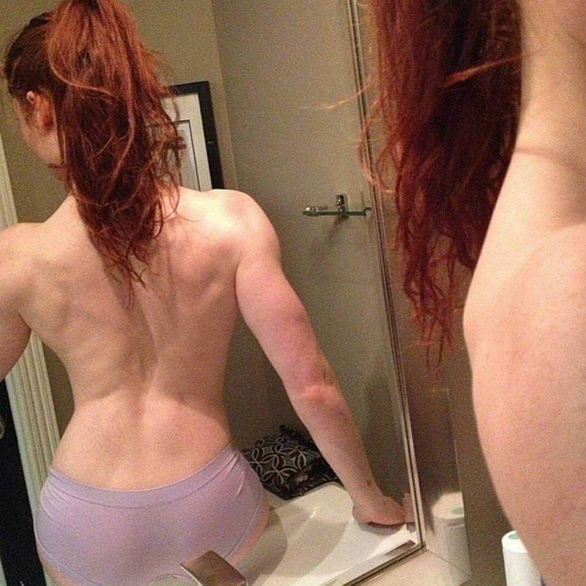 Abby Pollock showing her toned back and triceps.