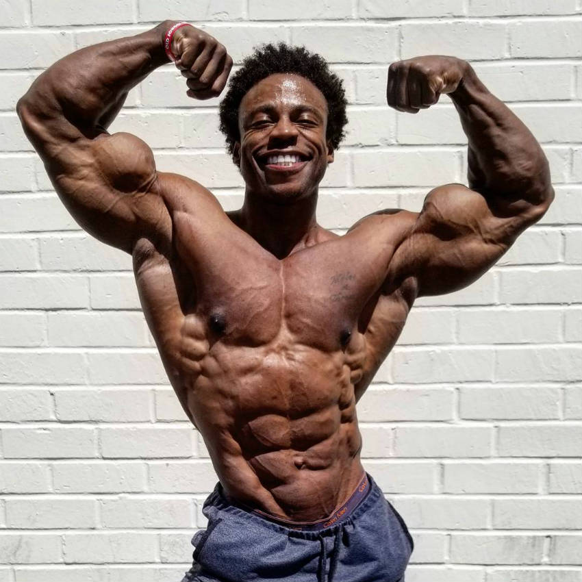 Breon Ansley showing his upper body cut, with his highly visible abs and obliques