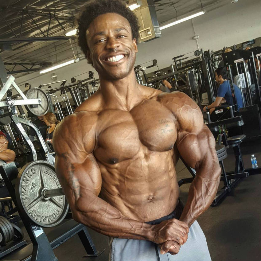 Breon Ansley tensing his chest in the gym while preparing for the 2017 Mr Olympia