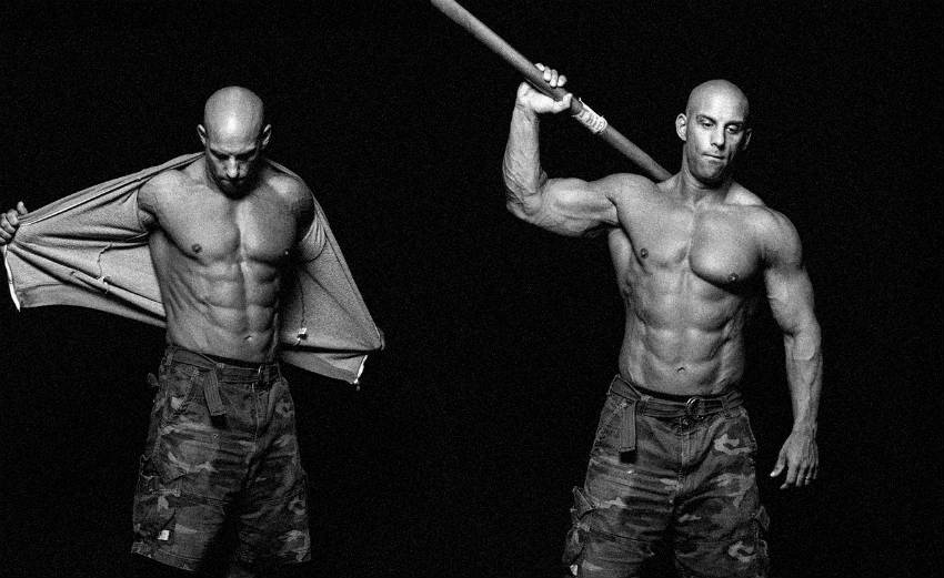 Christian Thibaudeau in double shot, showing his ripped abs, large arms and chest