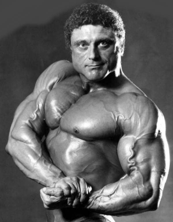 Frank Richards flexing his biceps and showing off his upper body for the camera