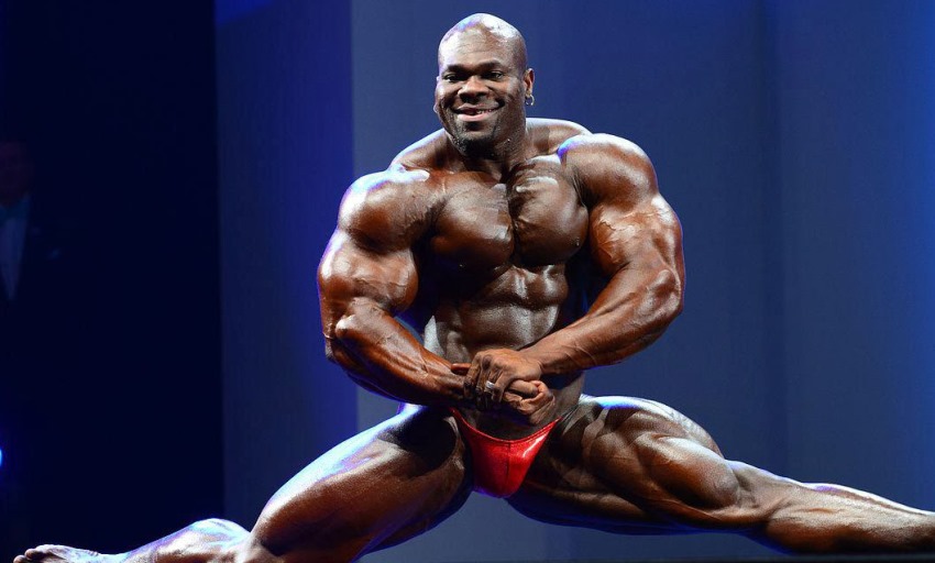 Lionel Beyeke improvising a leg split on the stage, as he shows his immaculate physique to the judges