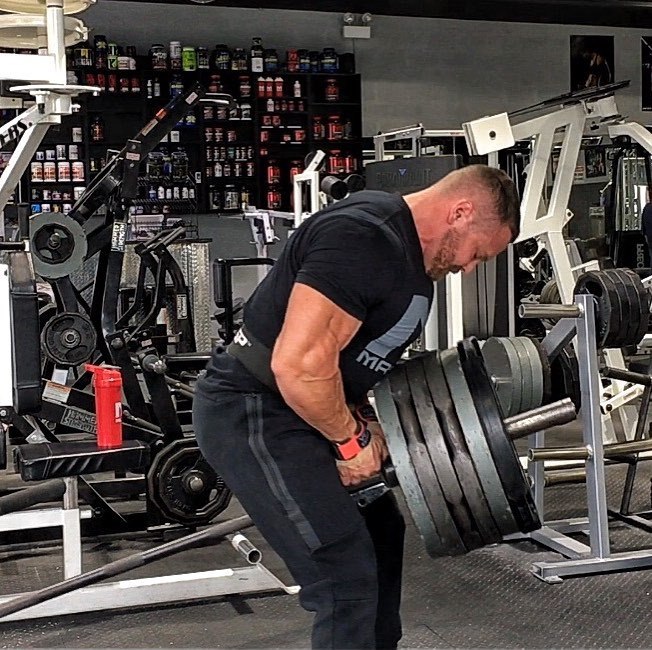 Marc Lobliner doing heavy t-bar rows in the gym