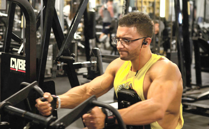 Matt Acton working out on the machine and showing his vascular arms and biceps 