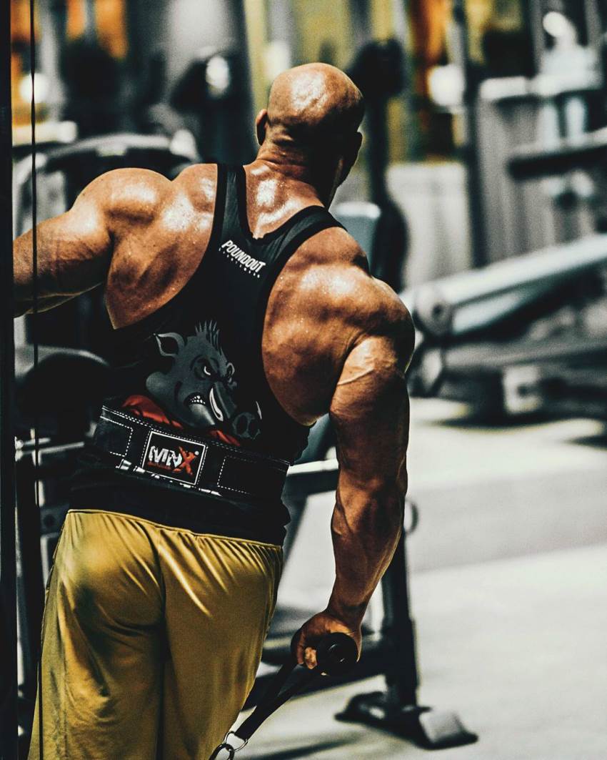 Shot of Petar Klancir's massive and shredded back in a black tank top