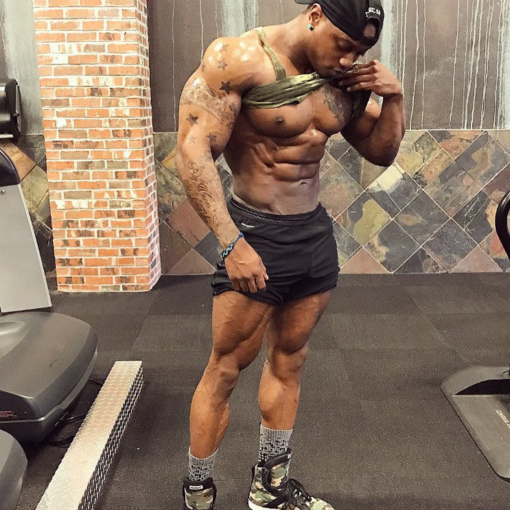 Brandon Hendrickson flexing his ripped abs, arms, and legs