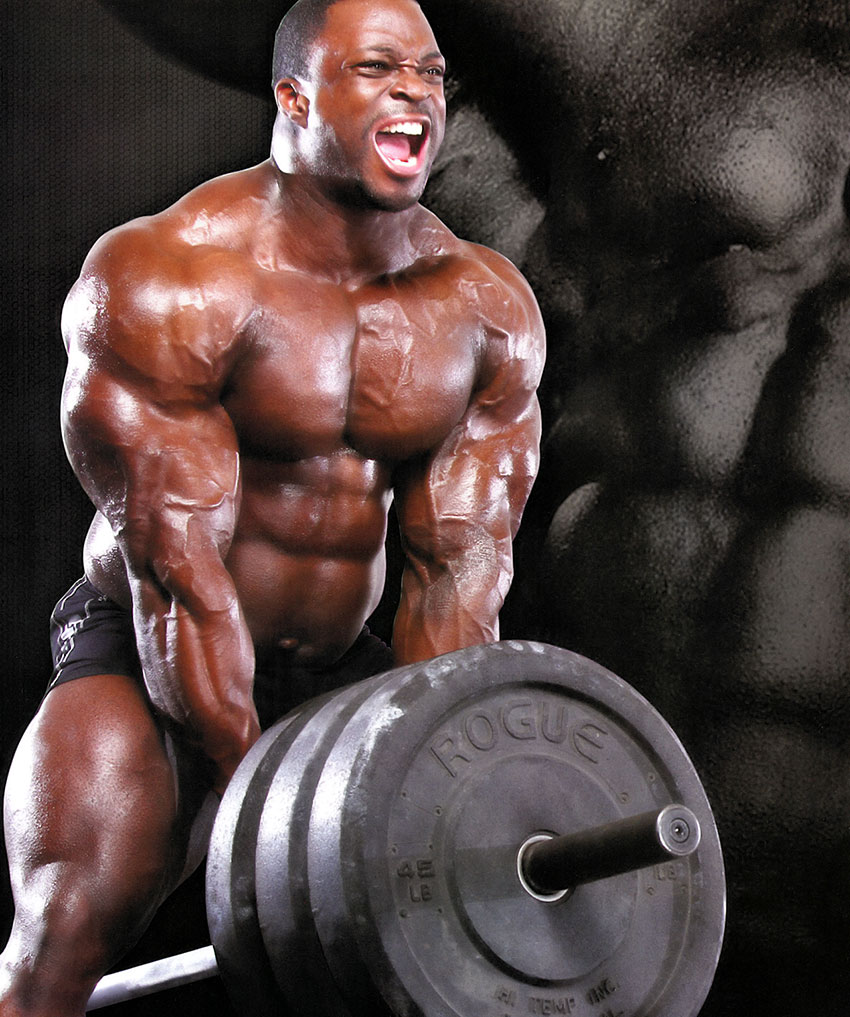 Brendon Ray performing a barbell row 