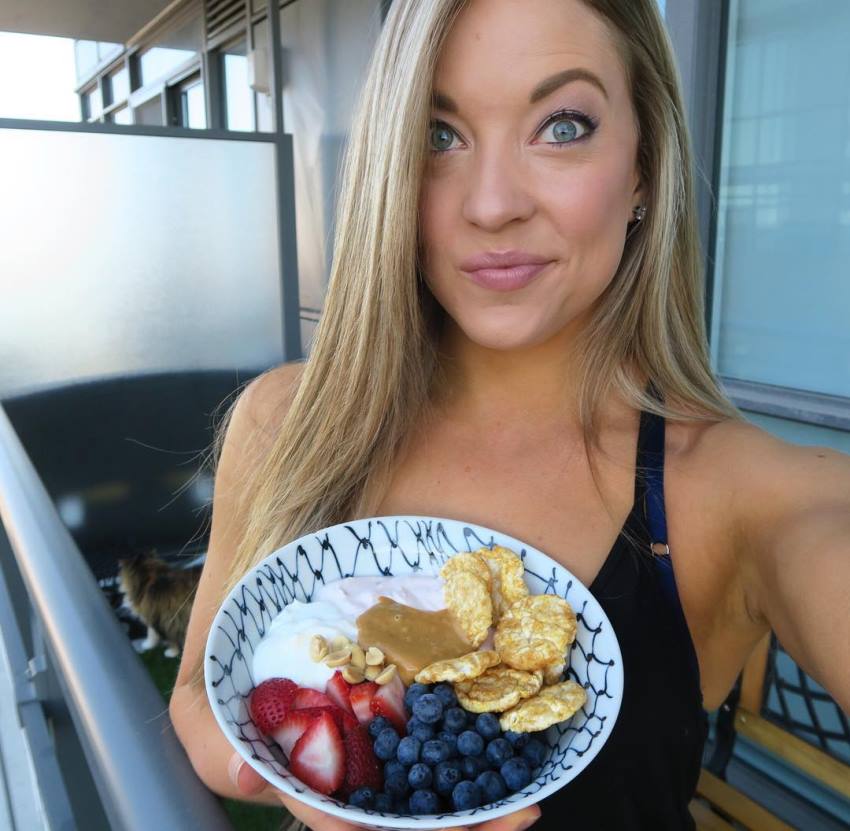 Katie Crewe showing her healthy meal consisting of strawberries, blueberries, and other healthy ingredients