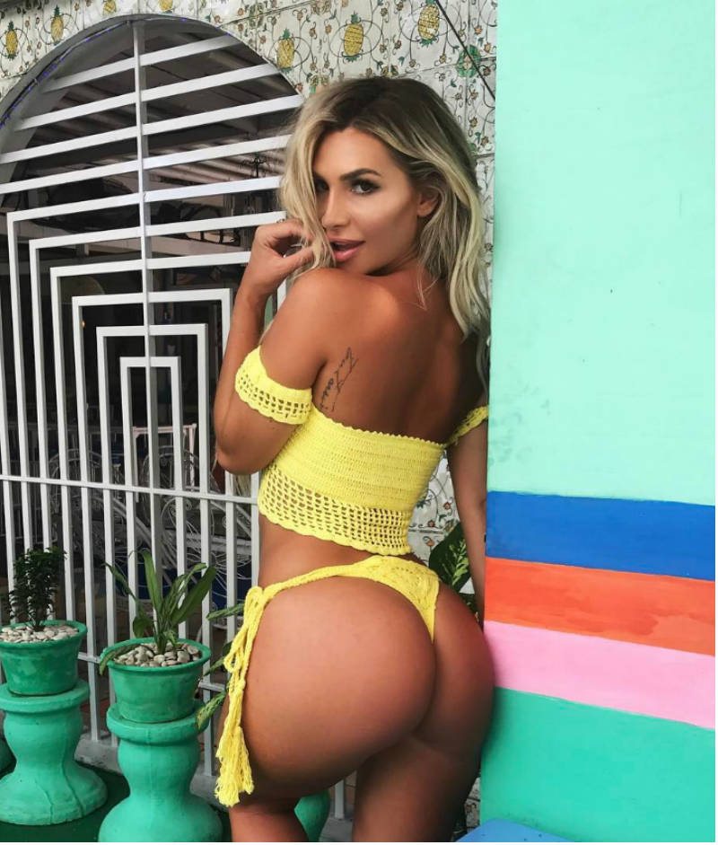 Rosanna Arkle wearing a bikini and showing off her large glutes