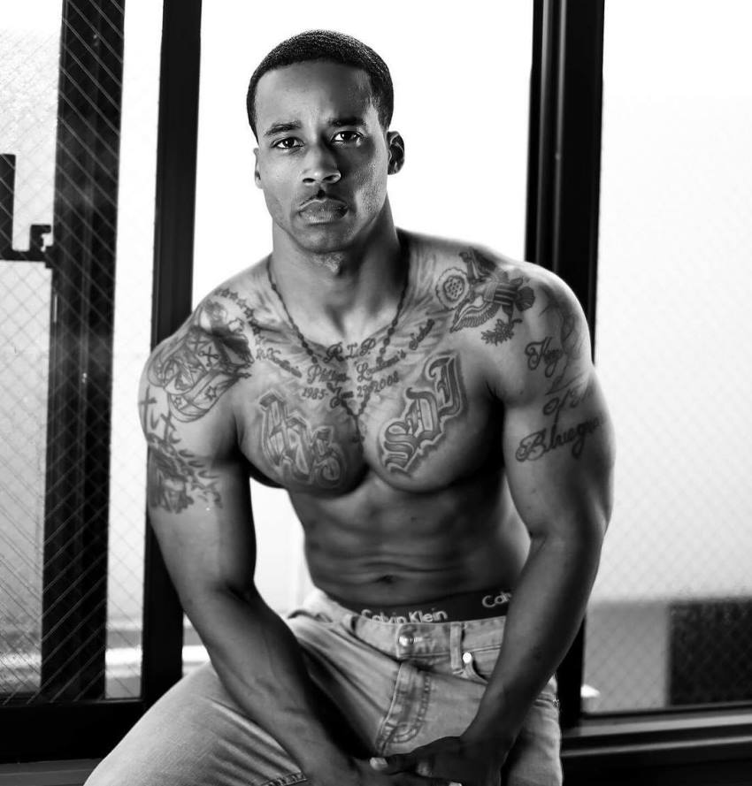 Andre Smith looking seriously at the camera, posing for a photoshoot, looking fit and healthy