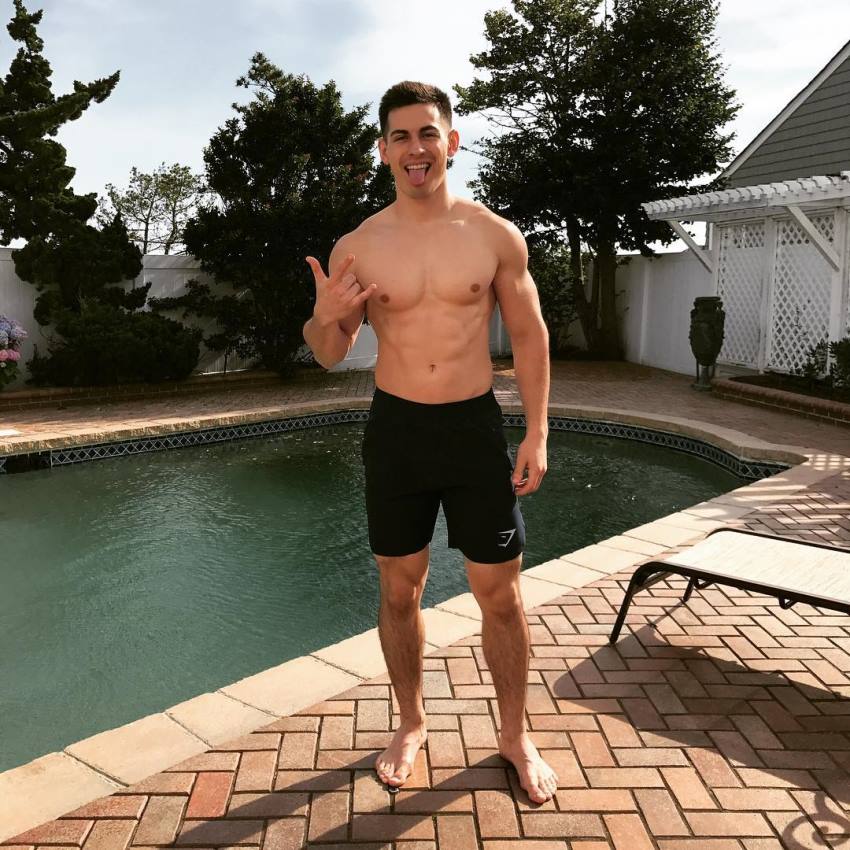 FaZe Censor standing by a pool making a gesture with his nad, looking lean and fit