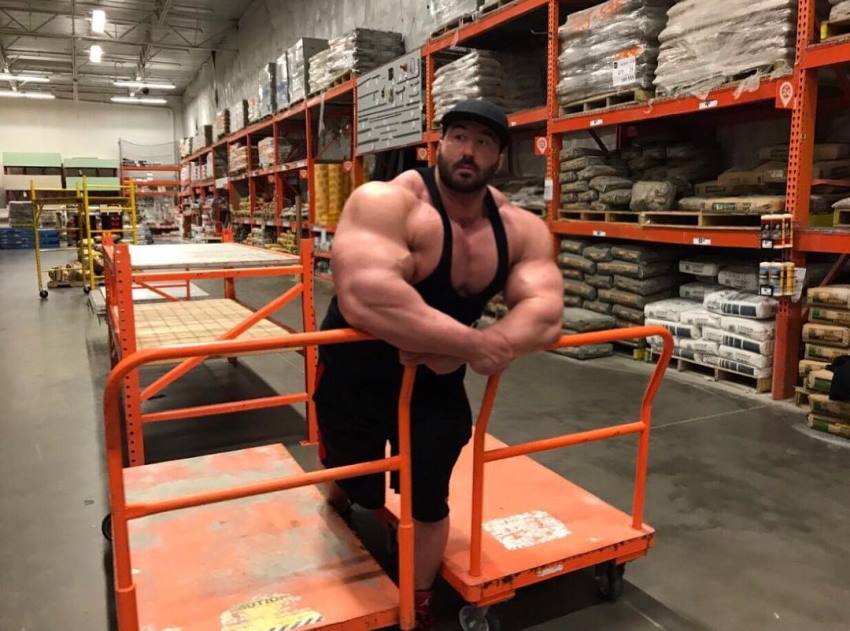 Craig Golias in a factory, looking huge