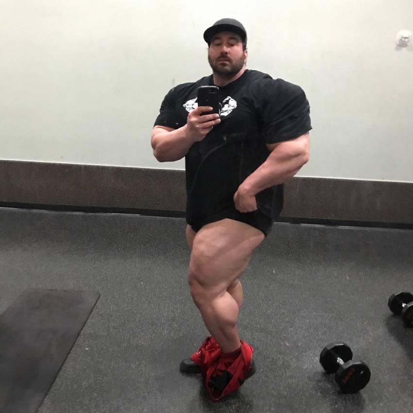 Craig Golias taking a selfie of hie big and ripped legs