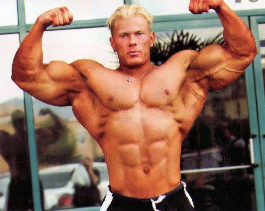 Dennis Wolf in his younger days, doing a front double biceps pose