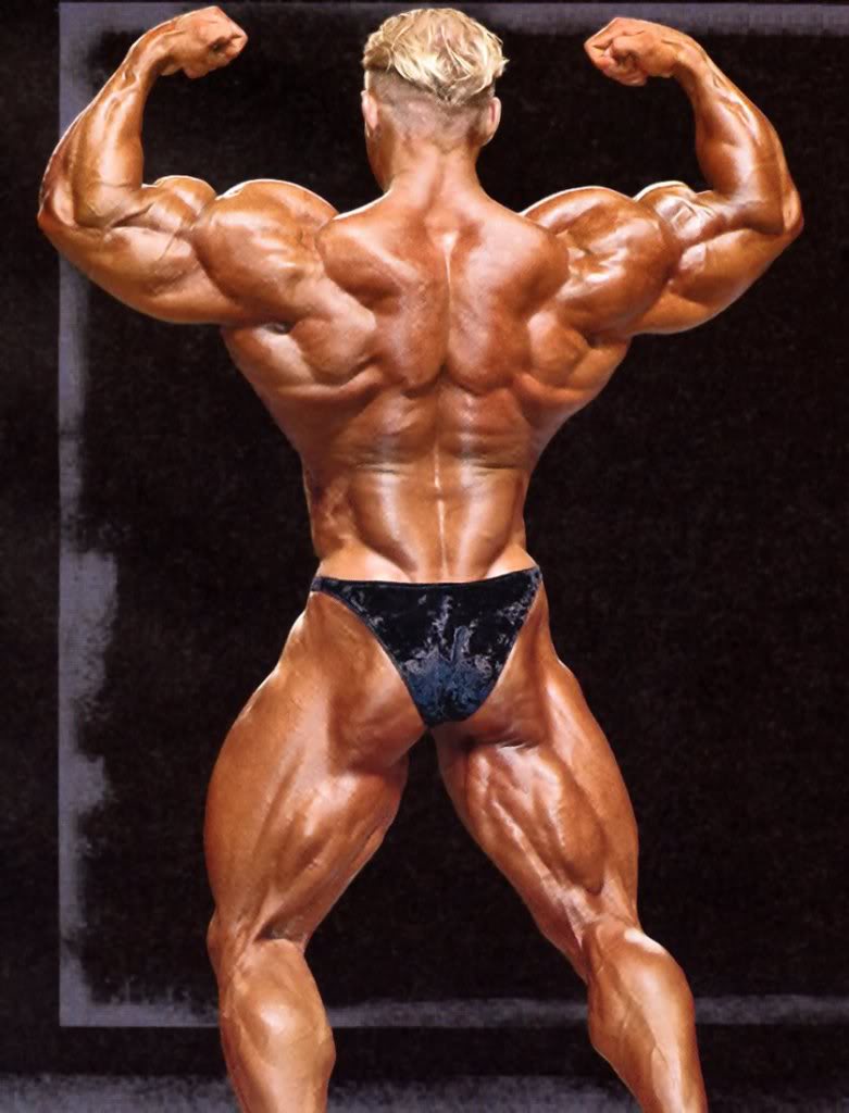 Dennis Wolf doing a back double biceps pose