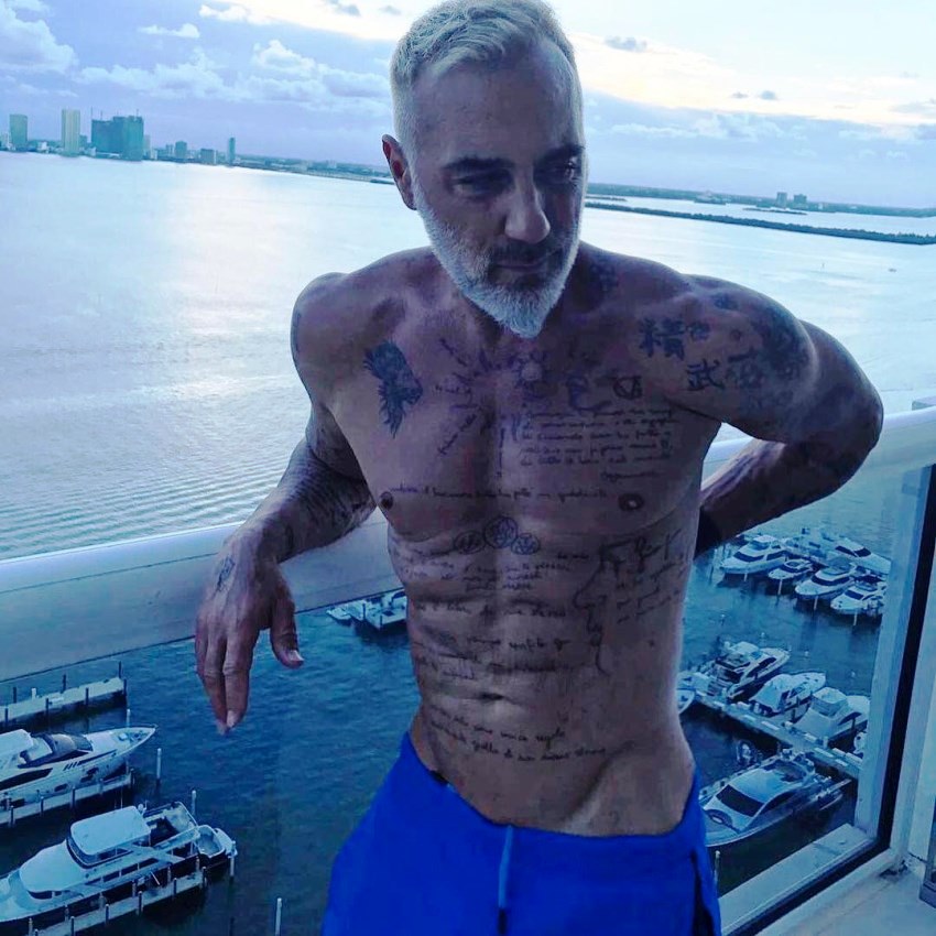 Gianluca Vacchi on top of a skyscraper in Miami, overlooking beautiful sea scenery