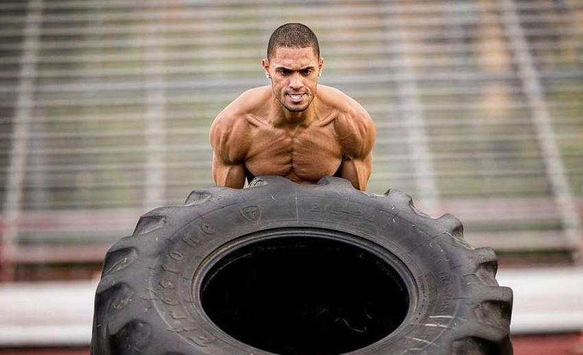 Ryan Tremaine Klarenbach flipping a big tire