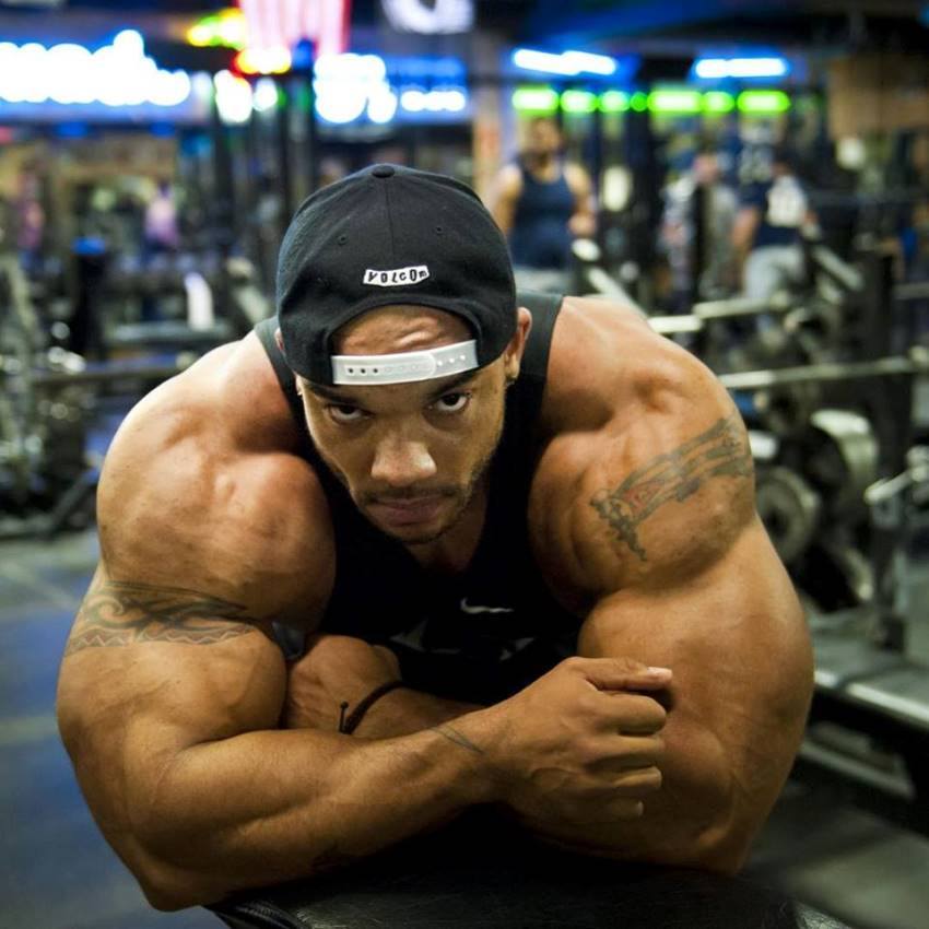 Sergio Oliva Jr leaning against a bench in the gym