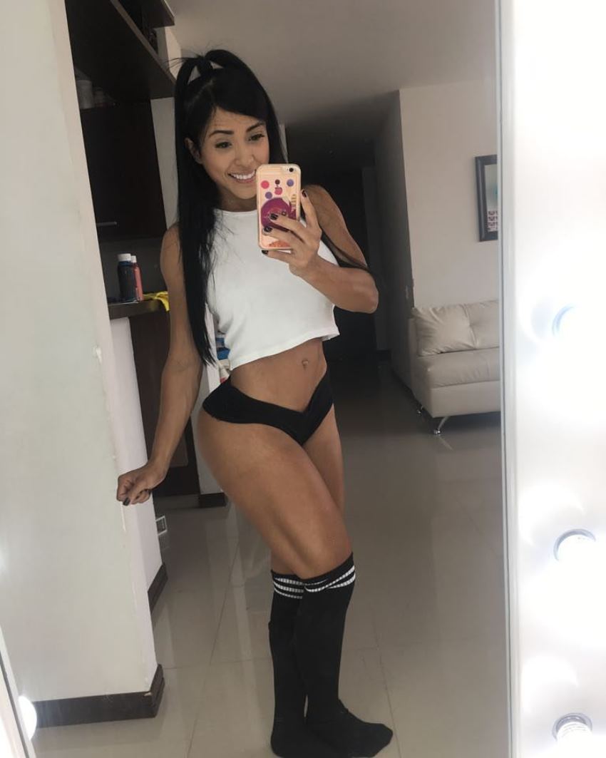 Alejandra Gil taking a selfie of her curvy legs